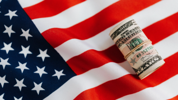 American flag with money with focus on a hand dryer price