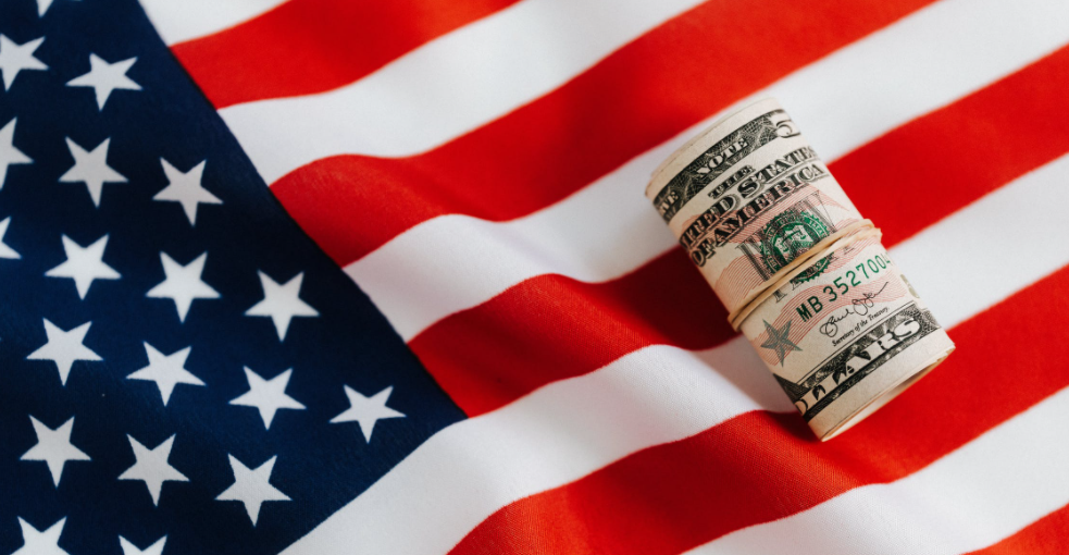 American flag with money with focus on a hand dryer price